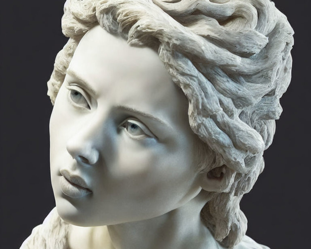 Detailed sculpture of a woman's head with expressive eyes and wavy hair