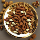 Assorted Nuts on Gold Plate Grey Background