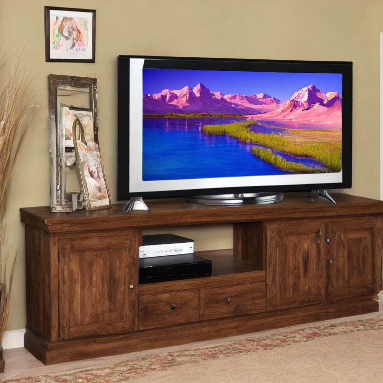 Flat-Screen TV on Wooden Console with Cabinets and Photo Frame