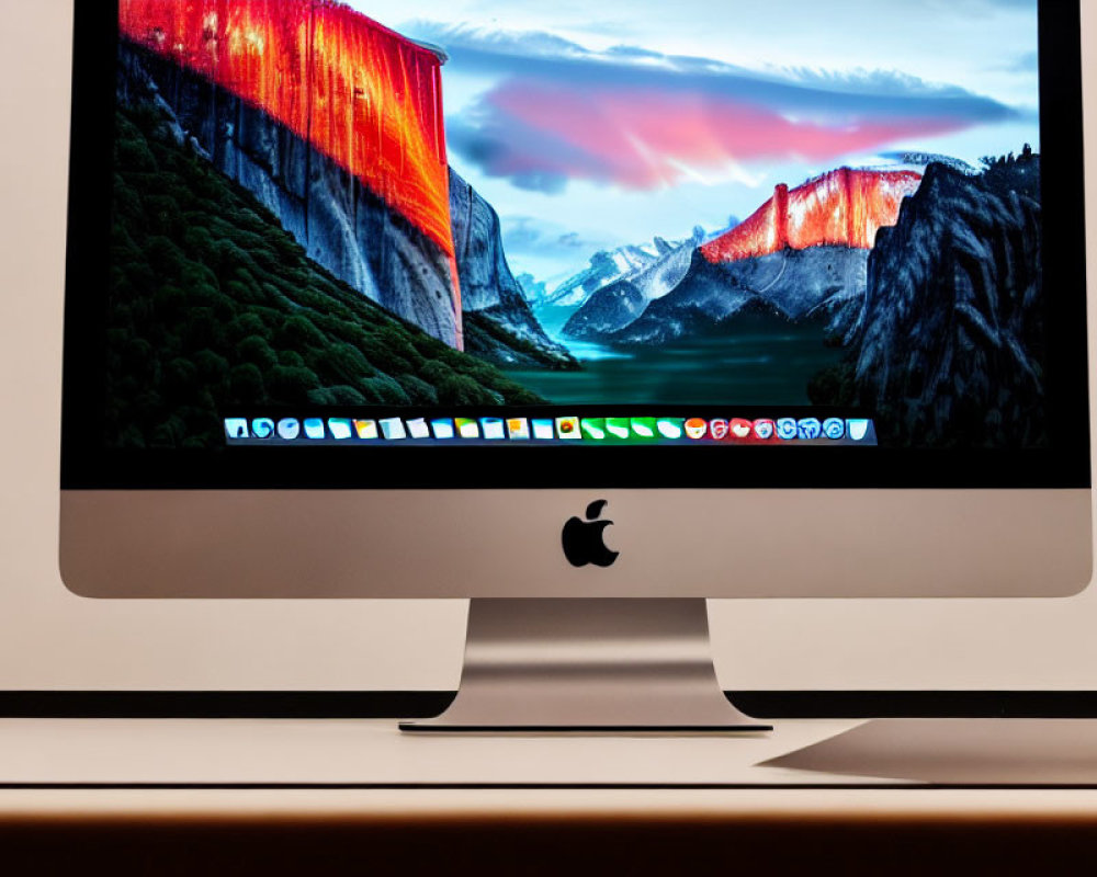 Desktop wallpaper of mountain landscape on Apple iMac.