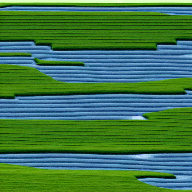 Vibrant green and blue terraced agricultural fields in a topographic pattern