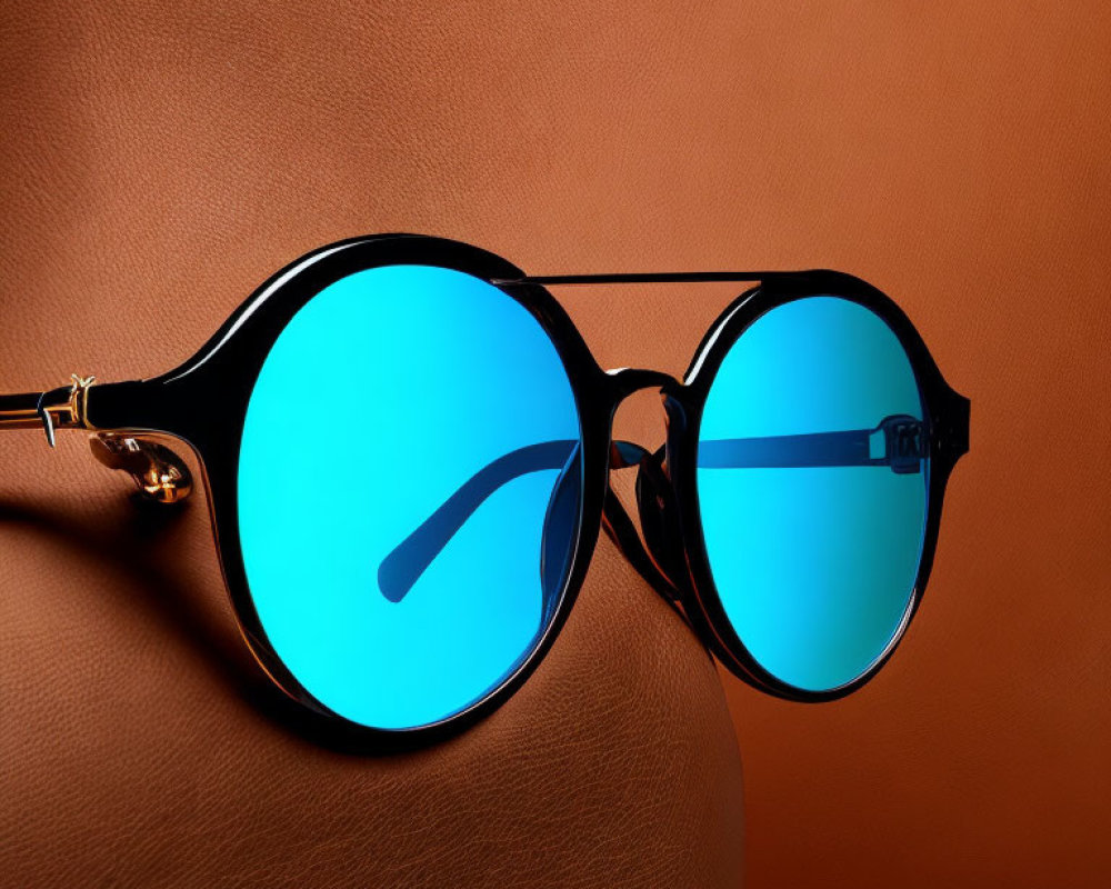 Blue Lens Sunglasses with Black Frames on Brown Background