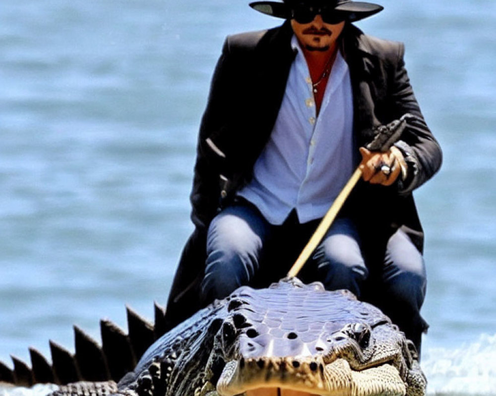 Person in Black Hat and Sunglasses Riding Alligator by Water