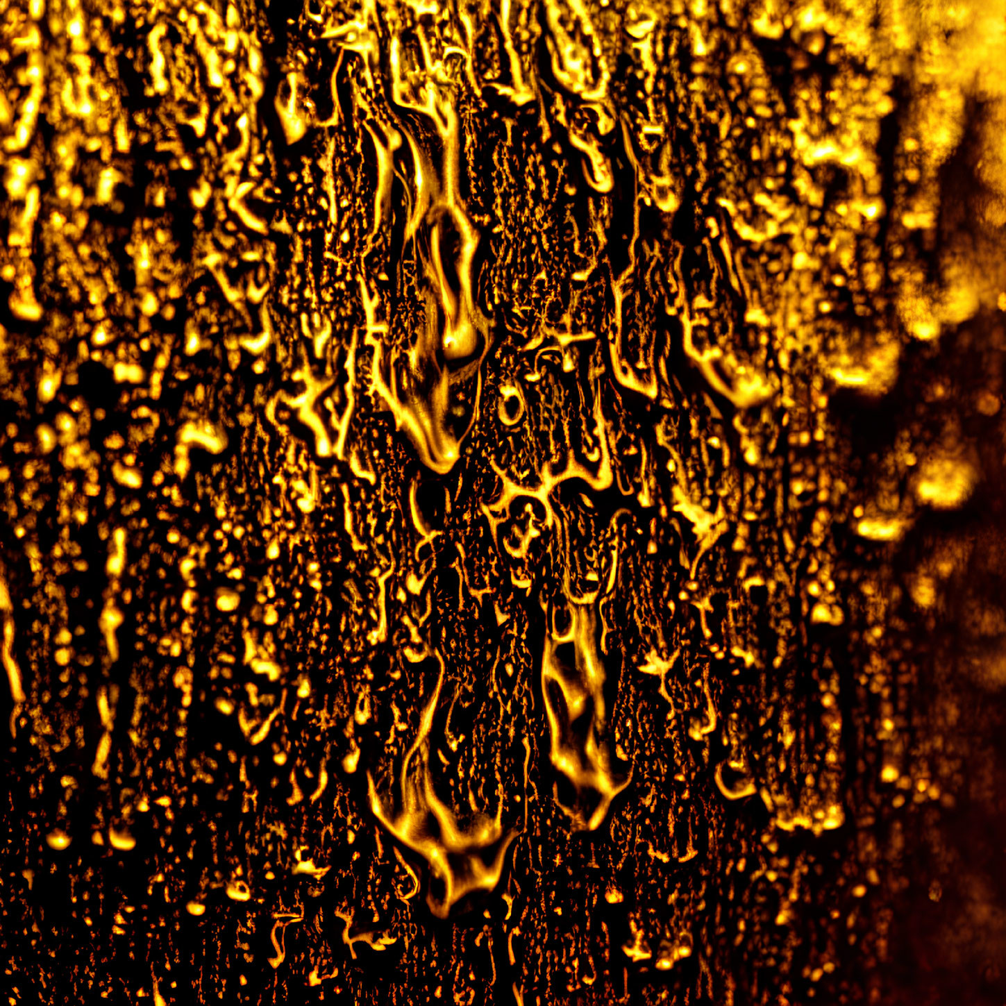 Abstract Golden Droplets Creating Intricate Patterns