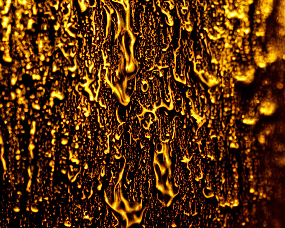 Abstract Golden Droplets Creating Intricate Patterns