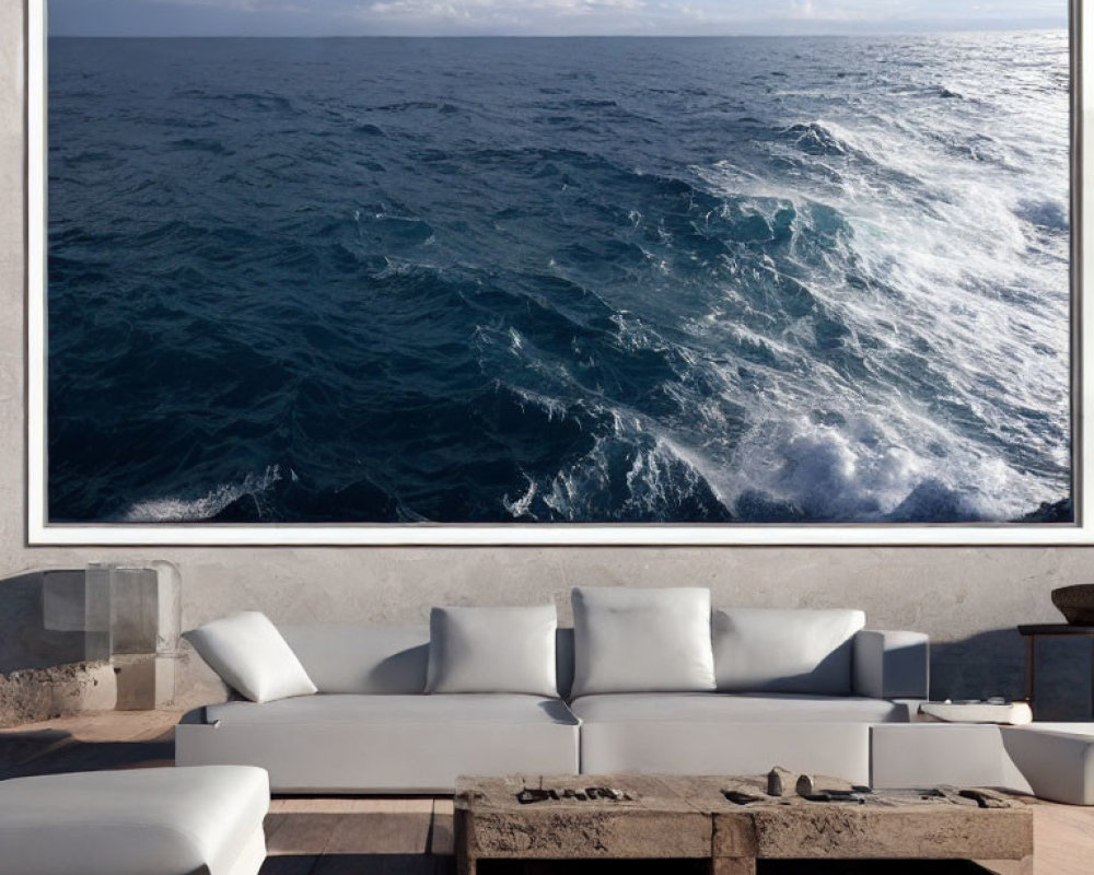 Contemporary living room with ocean photograph, white sectional sofa, wooden coffee table, and sea view terrace