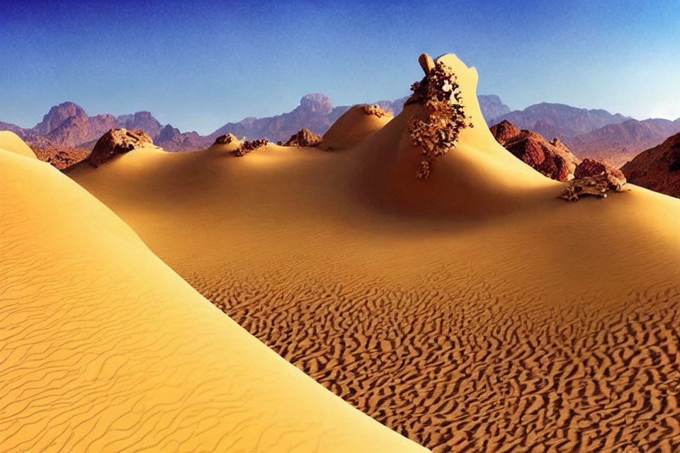 Tranquil desert landscape with dunes, blue sky, and mountains