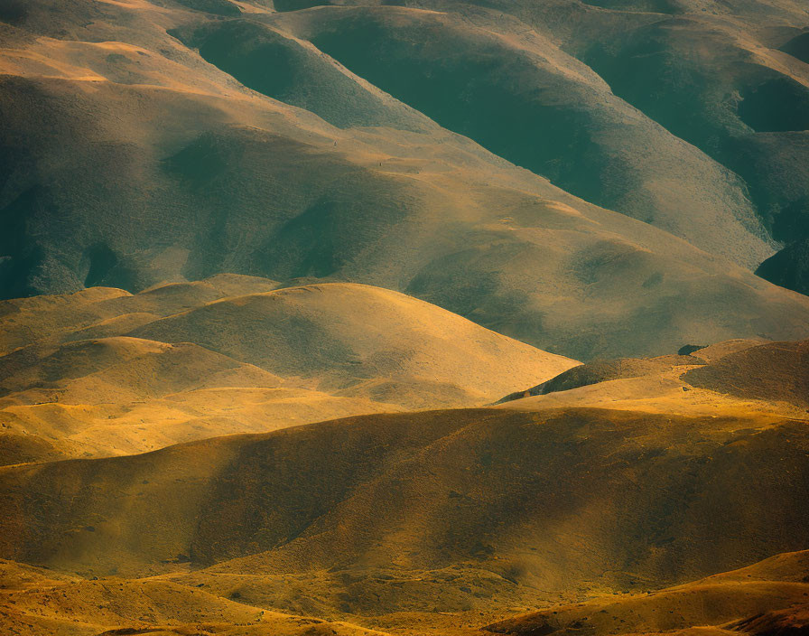 Tranquil landscape: Golden sunlight on rolling hills with earth-toned textures