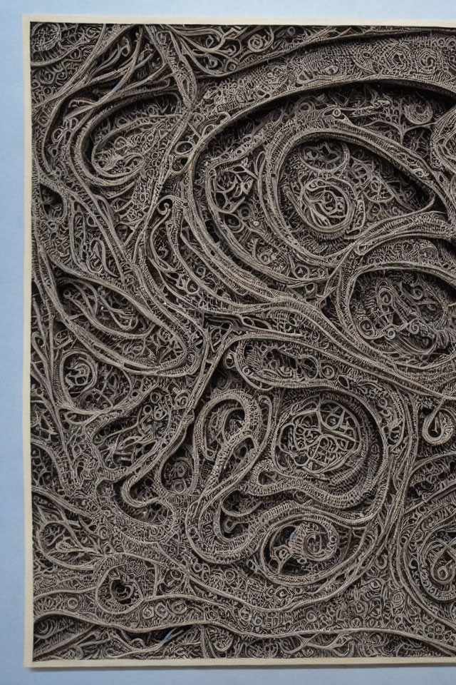Detailed Paisley-Inspired Paper Cut Art in Neutral Tones