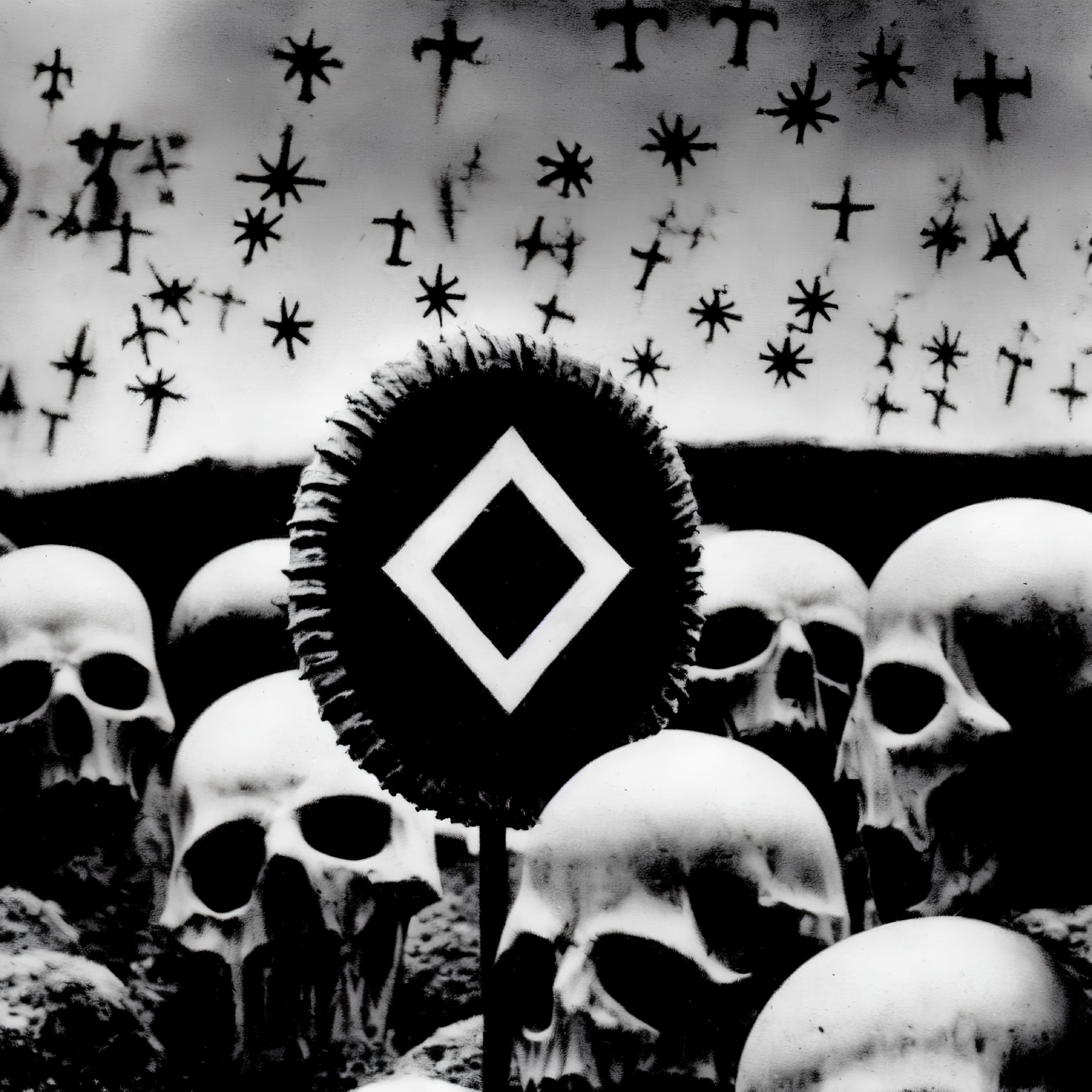 Monochrome artwork: Skull-filled field with emblem and crosses.