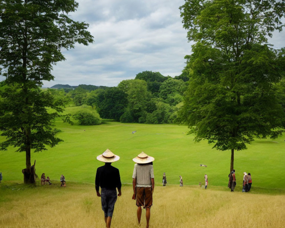 Two people in straw hats walking in golden field towards green landscape.