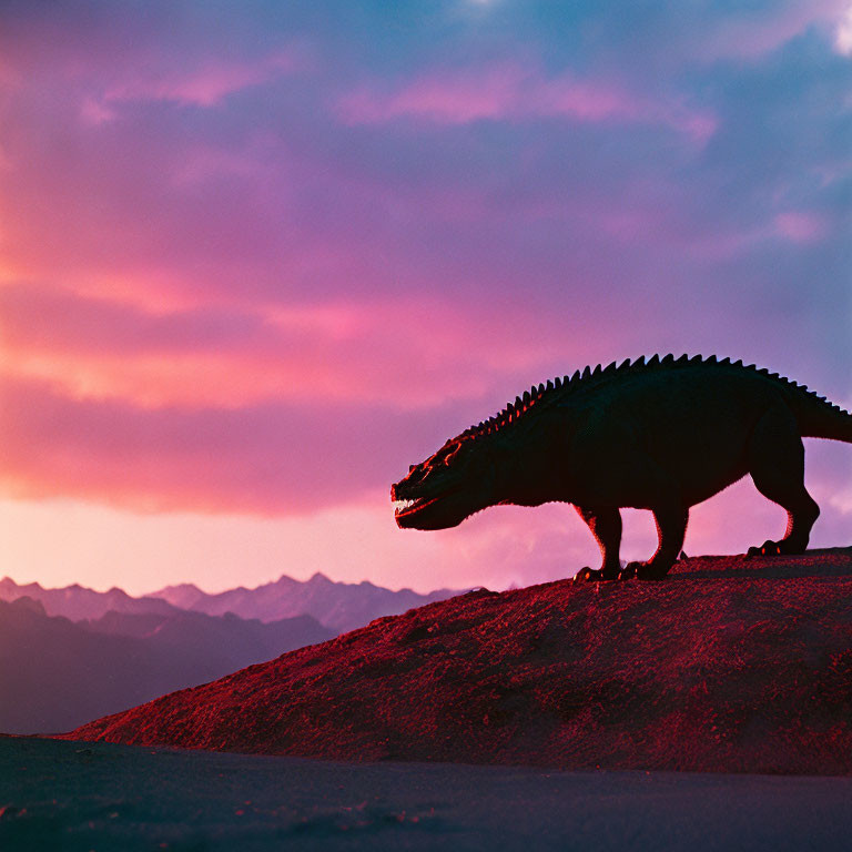 Dinosaur Silhouette Against Vibrant Sunset Sky