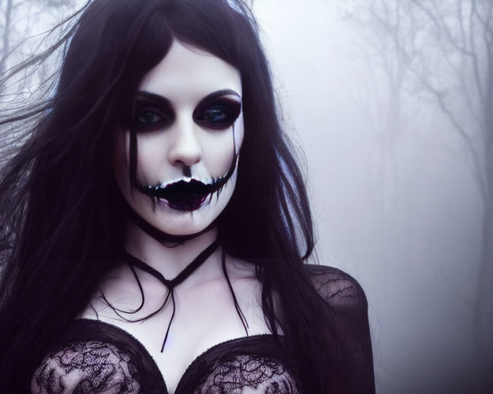 Gothic woman in dark makeup in foggy setting