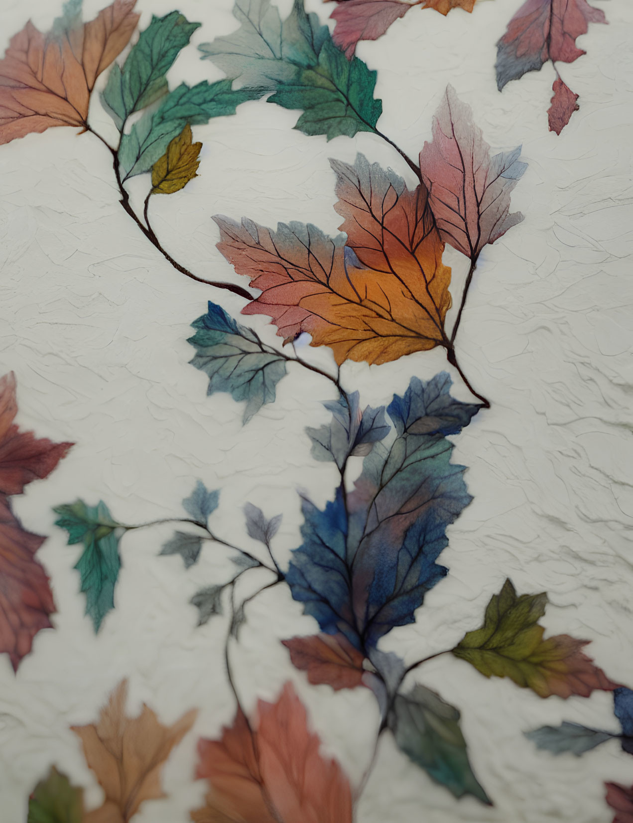 Vibrant colorful leaves on textured white background