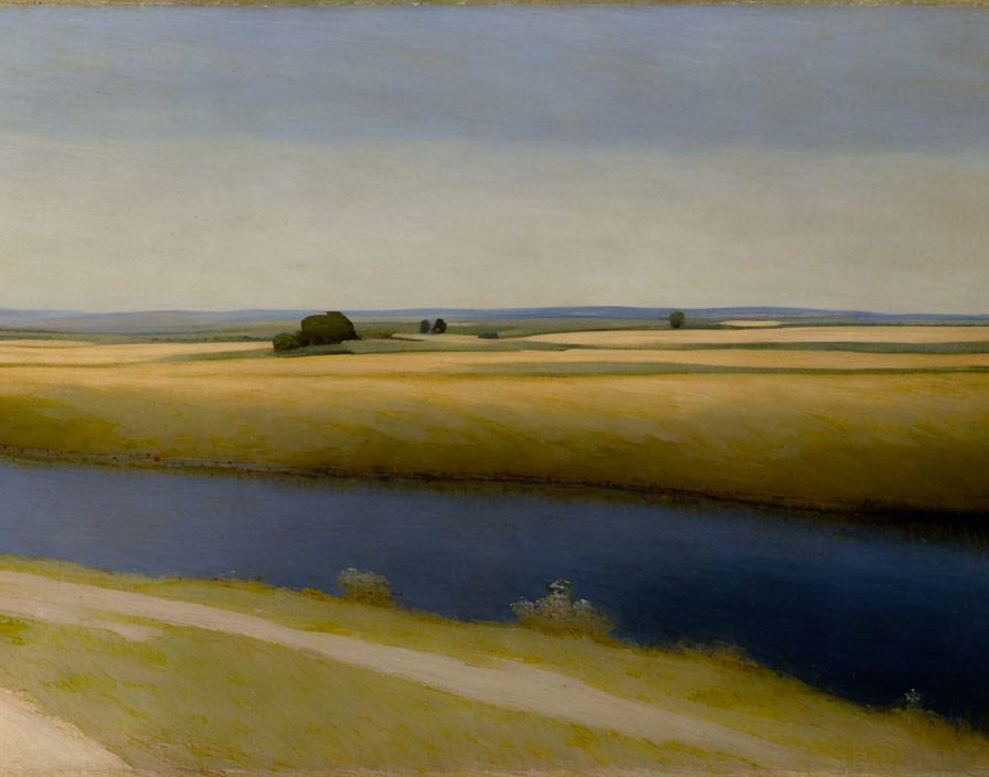 Tranquil landscape with river, golden fields, and distant trees