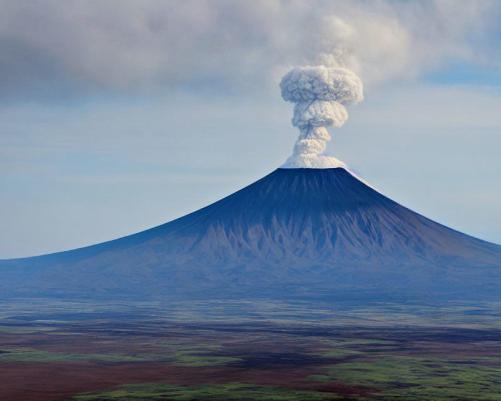 Conical volcano erupting smoke and ash over flat landscape