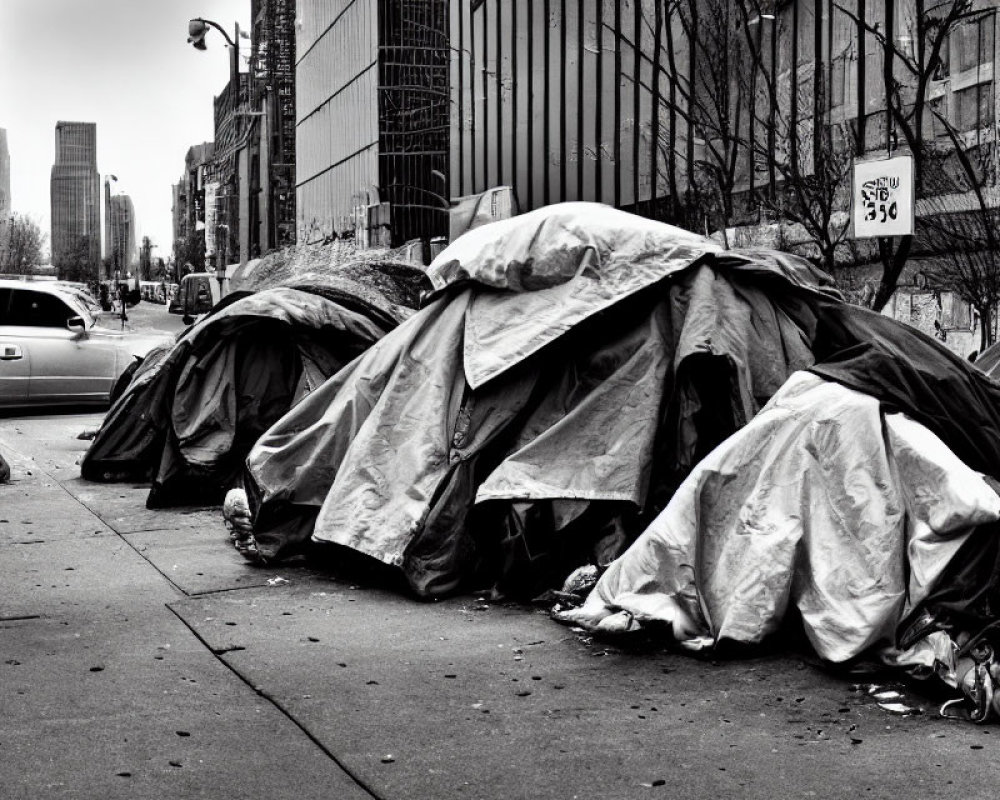 Urban sidewalk scene with makeshift tents and city buildings in background