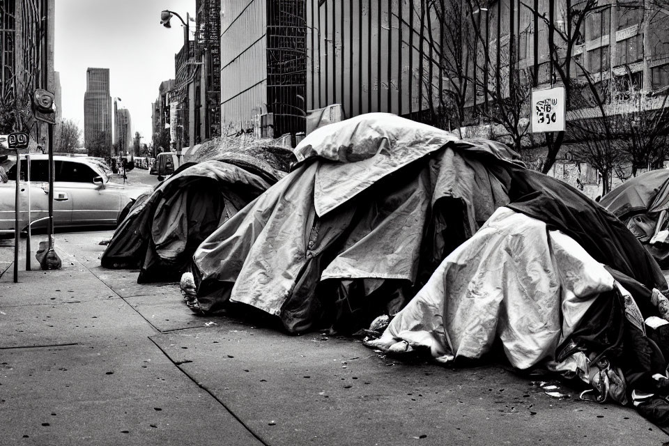 Urban sidewalk scene with makeshift tents and city buildings in background
