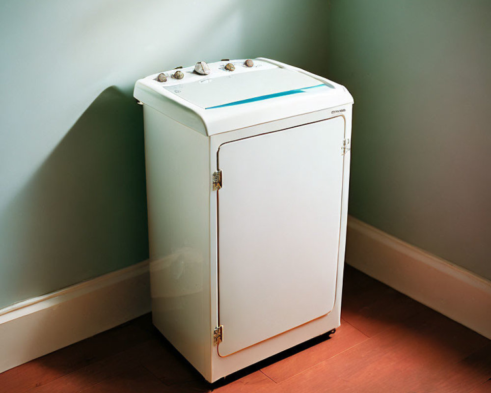 Vintage White Washing Machine with Analog Controls in Sunlit Corner