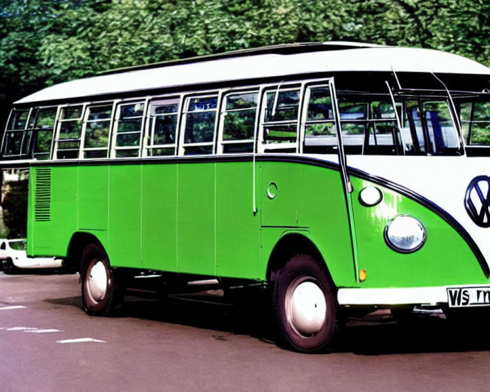 Vintage Green and White Volkswagen Bus Parked Among Lush Trees