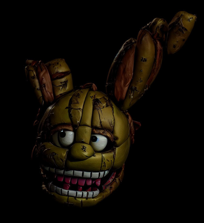 Damaged animatronic rabbit head with creepy features