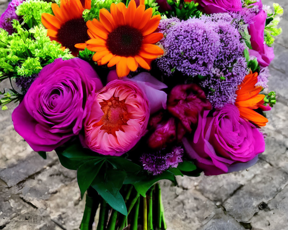 Colorful Bouquet of Purple Roses, Orange Gerberas, and Greenery on Cobblestone