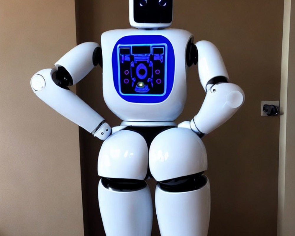 White humanoid robot with screen interface on chest and digital eyes