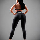 Athletic woman in sportswear poses confidently on grey background