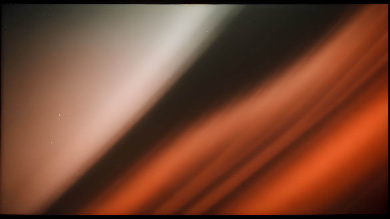 Blurred white and orange diagonal streaks background.