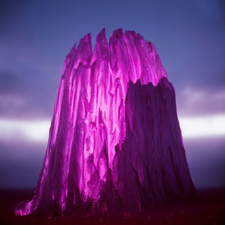 Majestic rock formation in purple twilight.