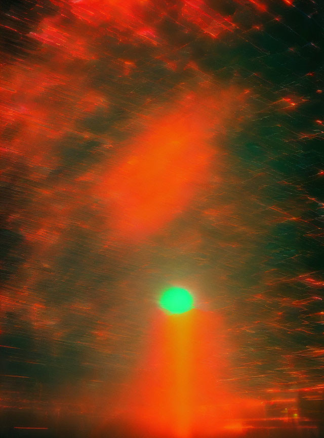 Abstract image: Warm red and orange hues, blurred sun glare with radiating light in textured pattern