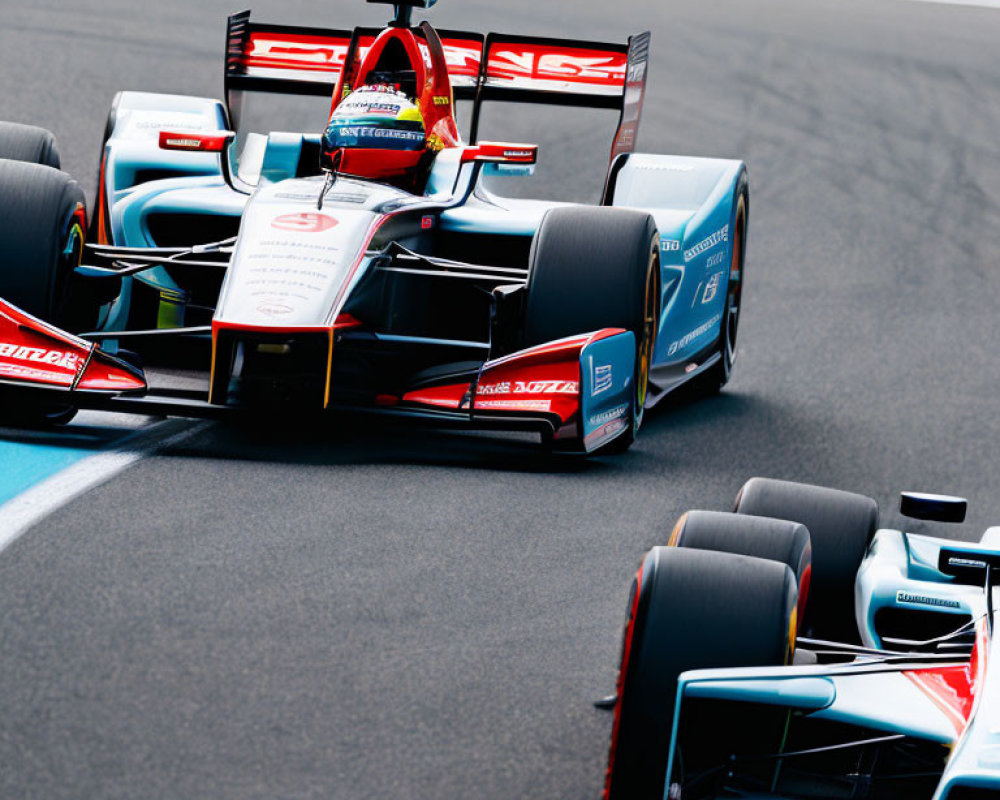 Two Formula E race cars in close competition on track with aerodynamic design and colorful liveries.