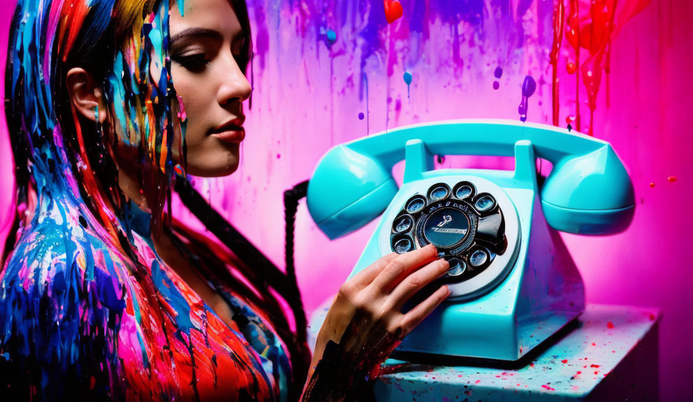 Colorful woman with paint on face and hand, contemplating retro blue rotary phone on vibrant background