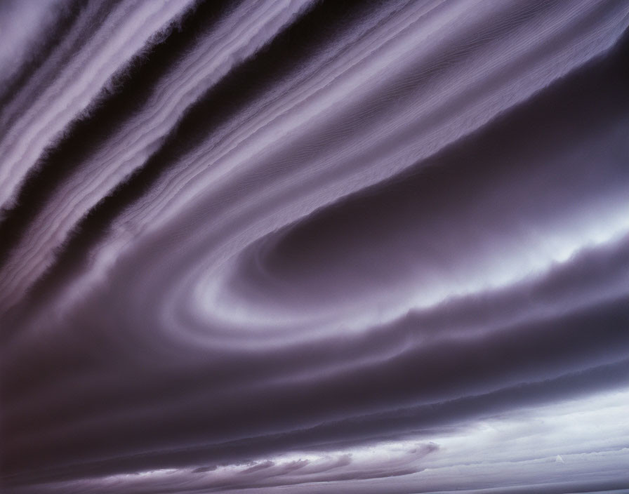 Vibrant purple sky with textured swirling clouds