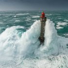 Lighthouse in Stormy Seas with Guiding Beacon