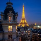 Twilight view of illuminated Eiffel Tower from old building window