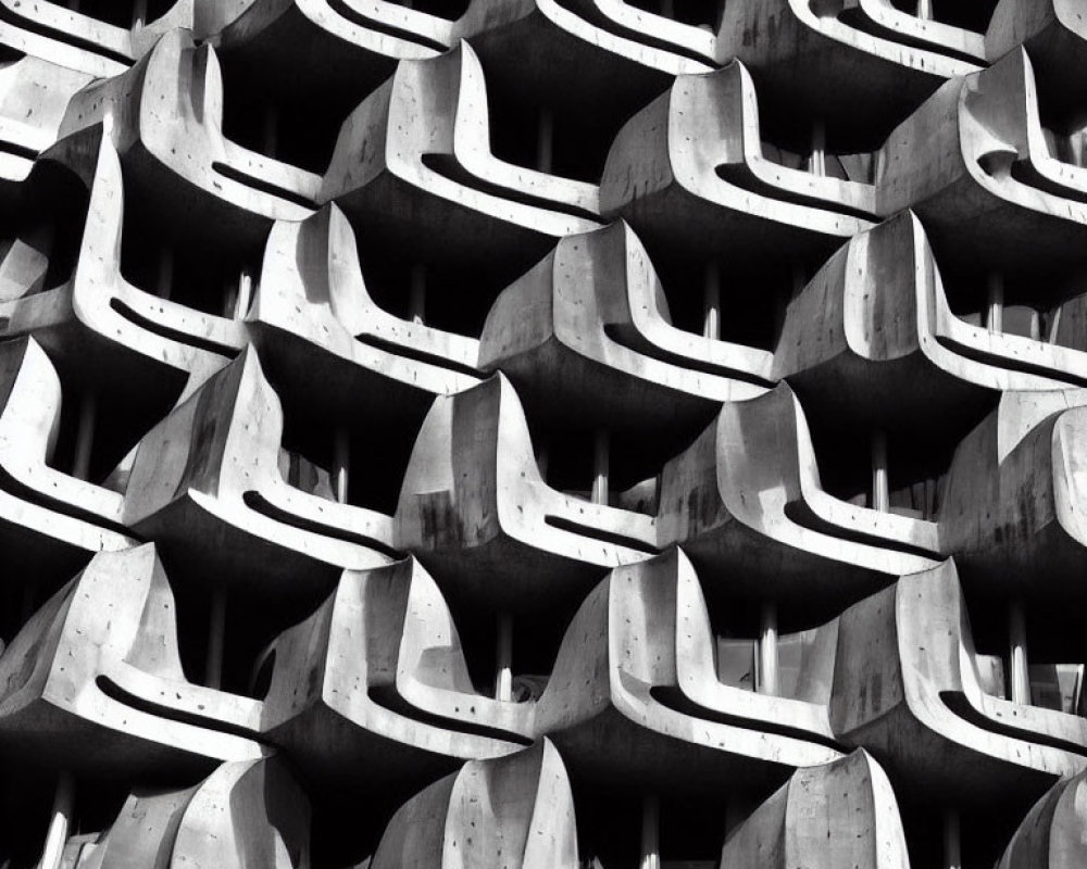 Monochrome abstract photo of building with wavy concrete balcony pattern