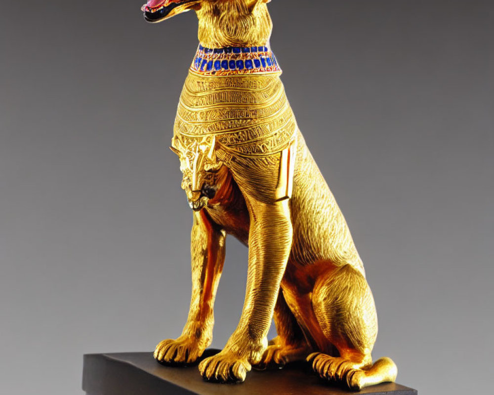 Gold-Plated Seated Dog Figurine with Egyptian-Style Collar on Black Pedest