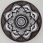 Intricate Wooden Mandala with Symmetrical Floral Designs