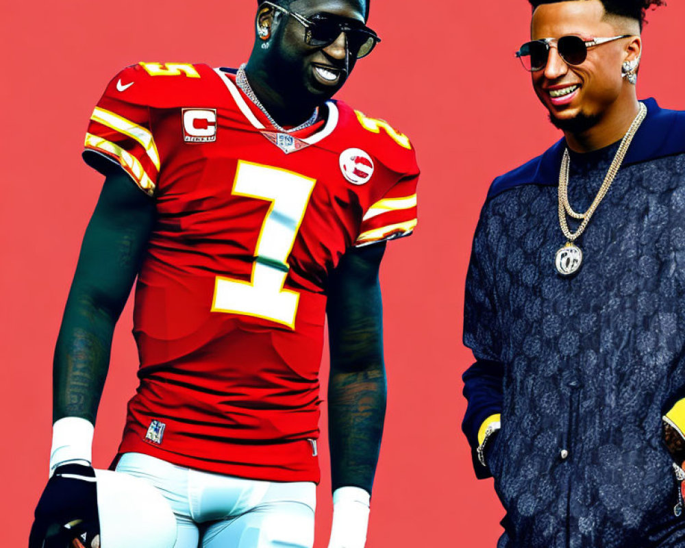 Two men in red American football and casual attire pose against red backdrop
