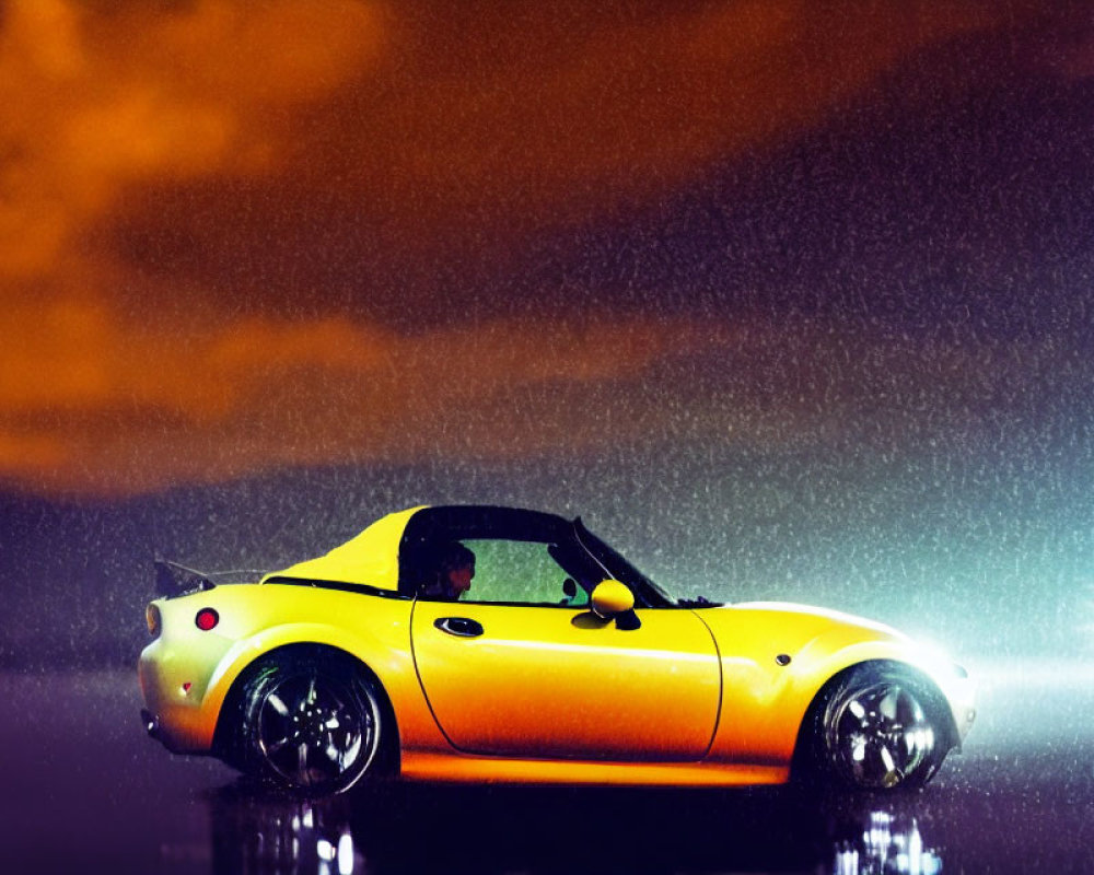Yellow sports car parked at night in rain with headlights on, reflecting on wet ground under orange sky
