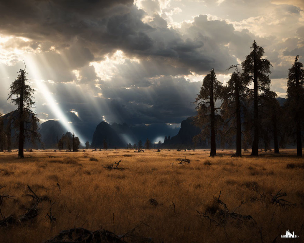Dramatic landscape with sunbeams, dark clouds, trees, and mountains