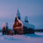 Snow-covered wooden structures in serene twilight winter landscape.