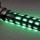Futuristic glowing green tube with metallic details and wires attached.