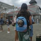 Person in Park with Dog-Printed Backpack