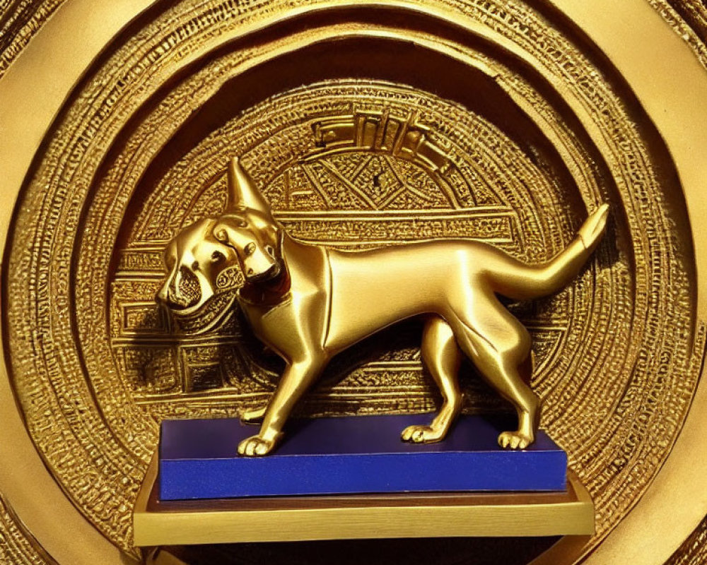 Golden Dog Statue on Blue Platform with Intricate Golden Background