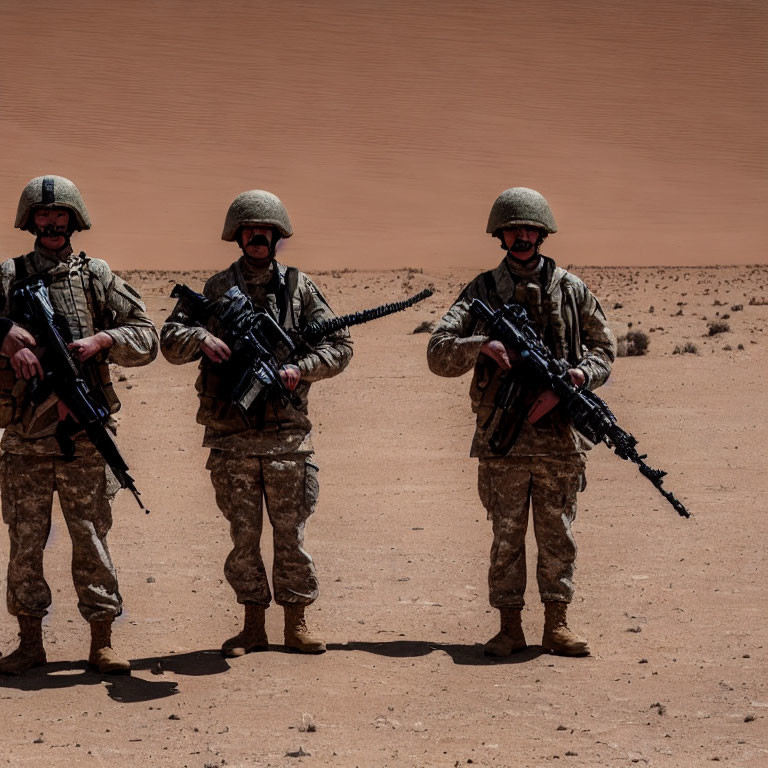 Military soldiers in desert camouflage with rifles and helmets