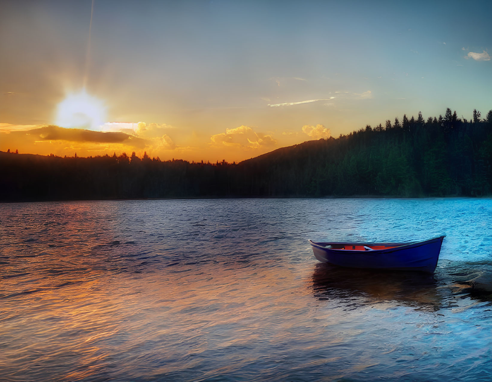 Tranquil sunset scene with solitary boat on lake and silhouetted trees