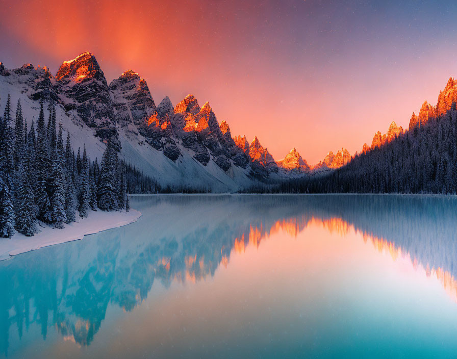 Snow-capped mountain peaks reflected in serene alpine lake at sunrise