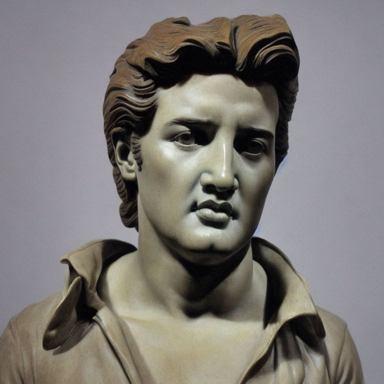 Male bust sculpture with wavy hair and intense gaze in classic style